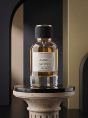 Caramel Qahwa perfume bottle on a luxury pedestal
